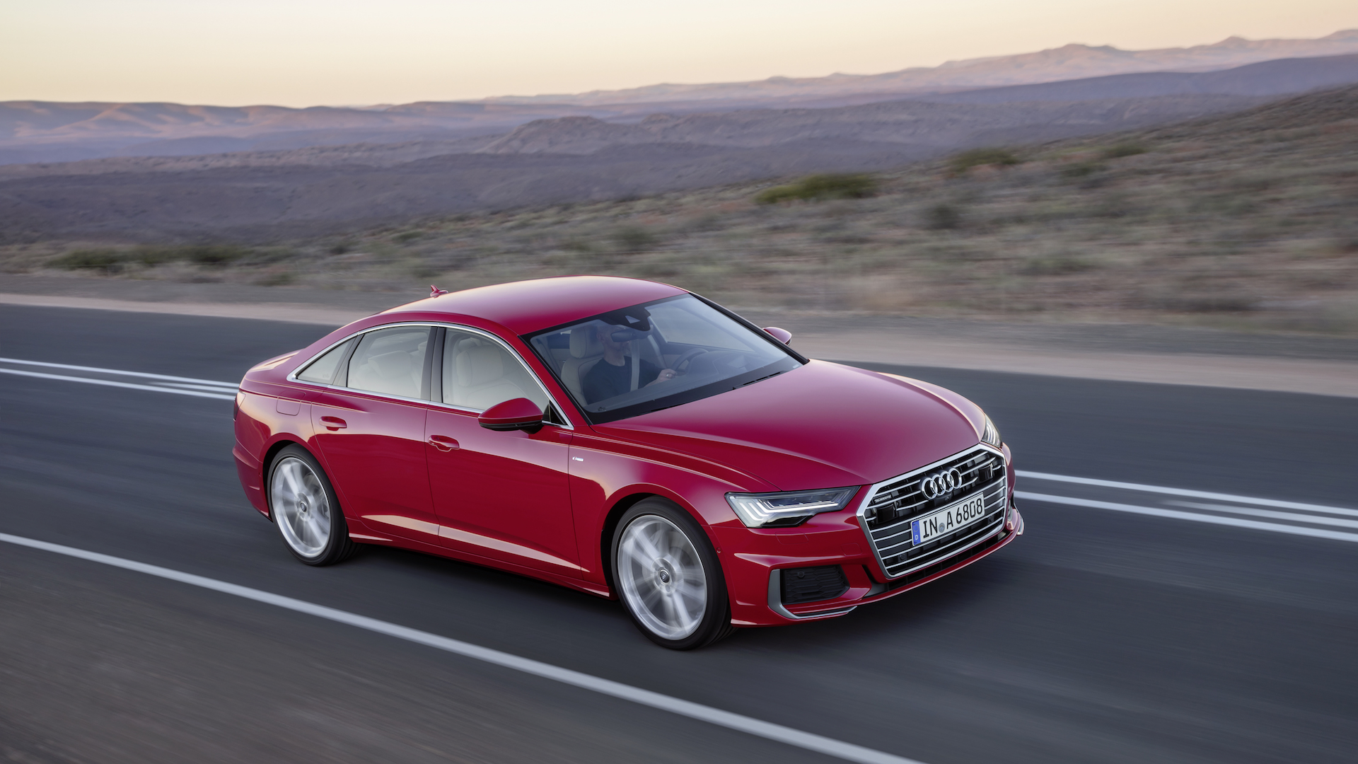 nuova audi a6 rossa montagne
