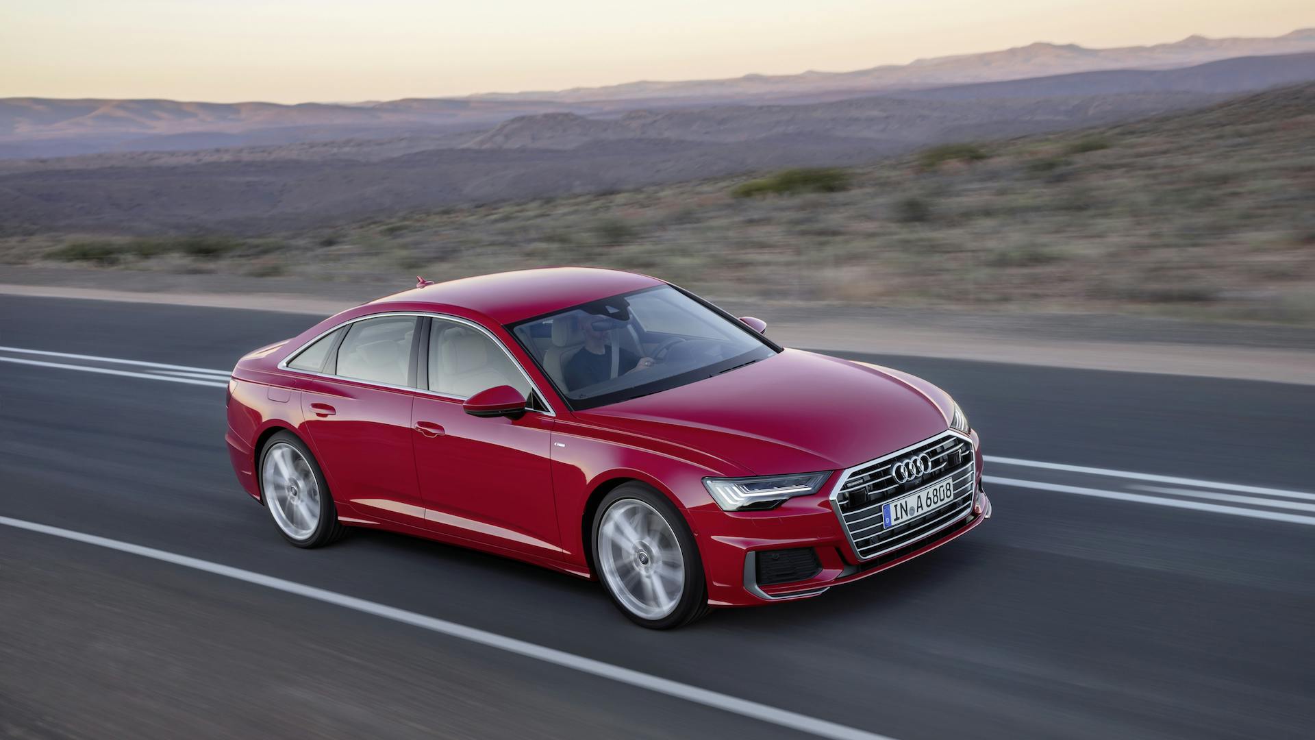 nuova audi a6 rossa montagne